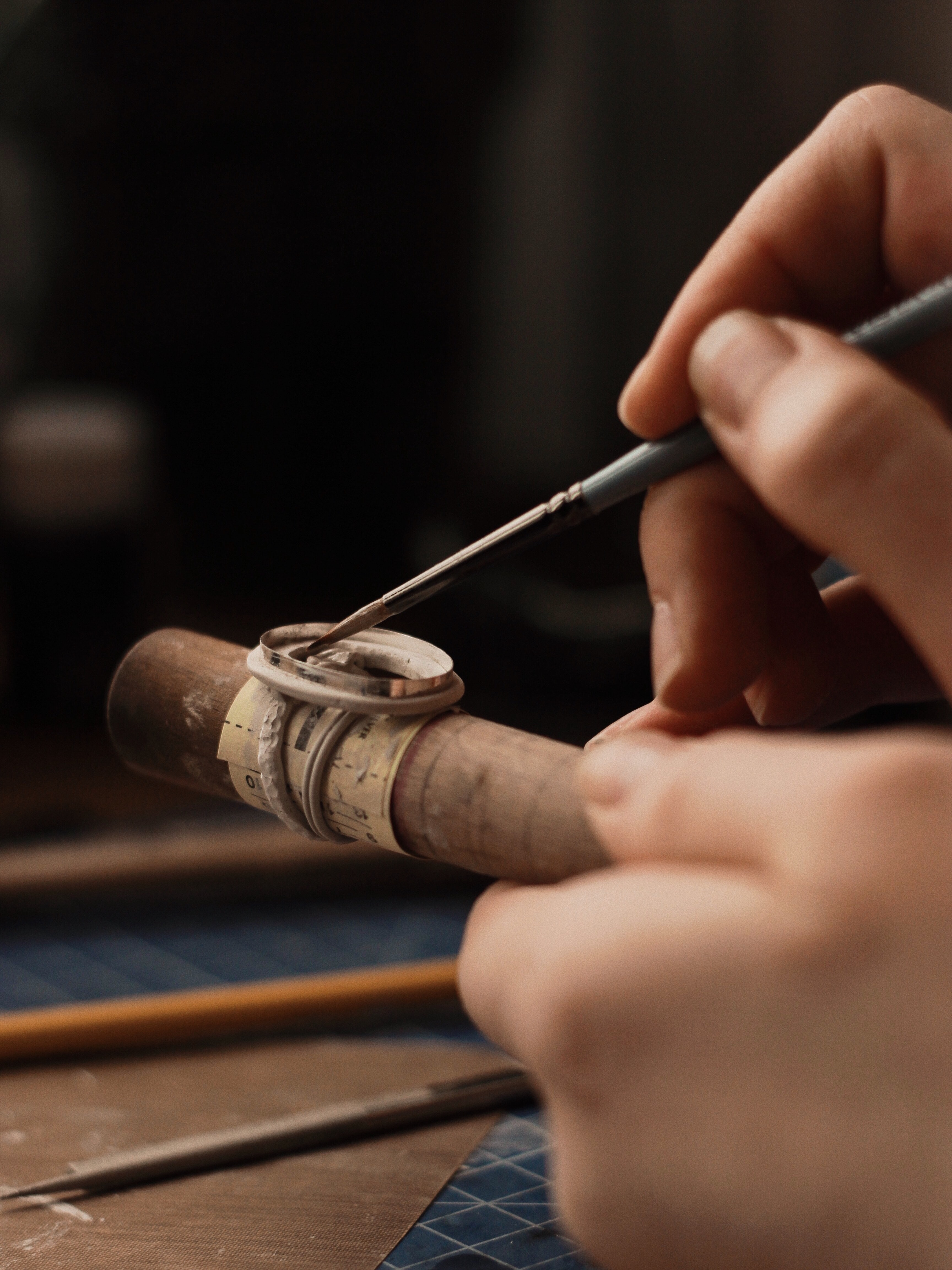 Closeup of hands painting a ring, Photo by Maksim Goncharenok from Pexels