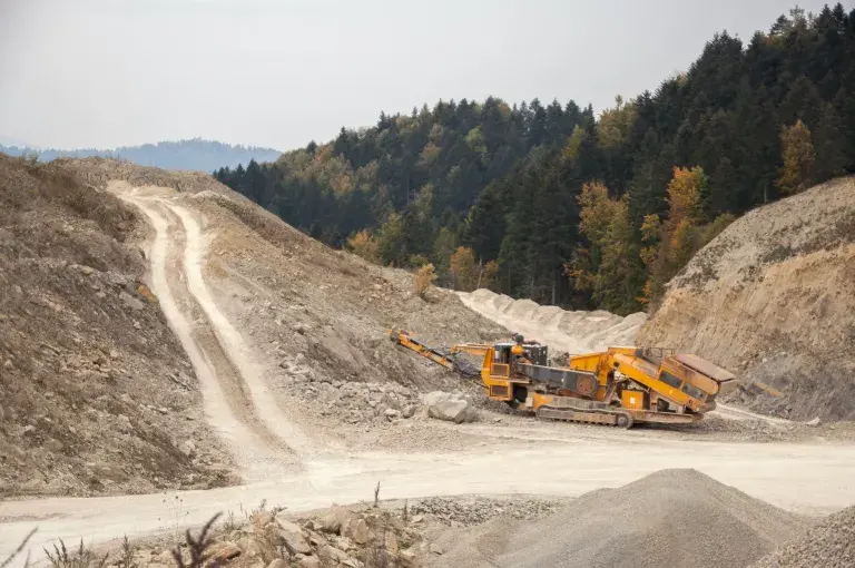 Image of an outdoor mine and JCB