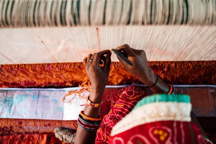 Hands weaving fabric